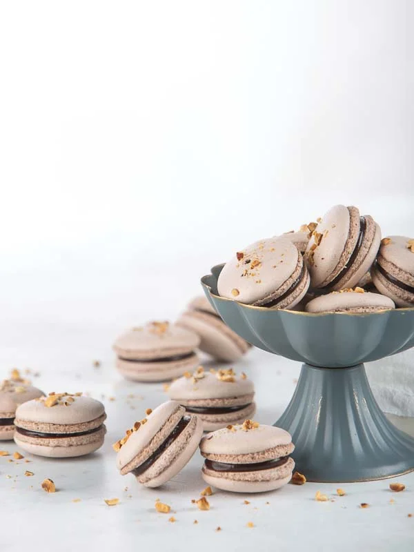 Macarons in Gray Bowl on Marble Counter
